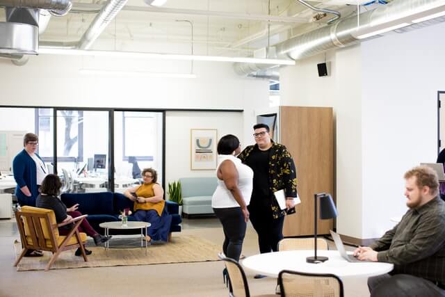 A group of people working in an office space.