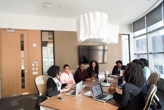 People holding a meeting in a conference room.
