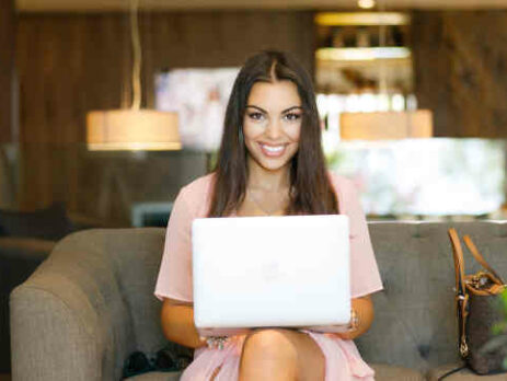 A woman using a laptop.