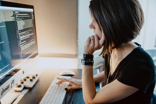 Woman working on a computer.