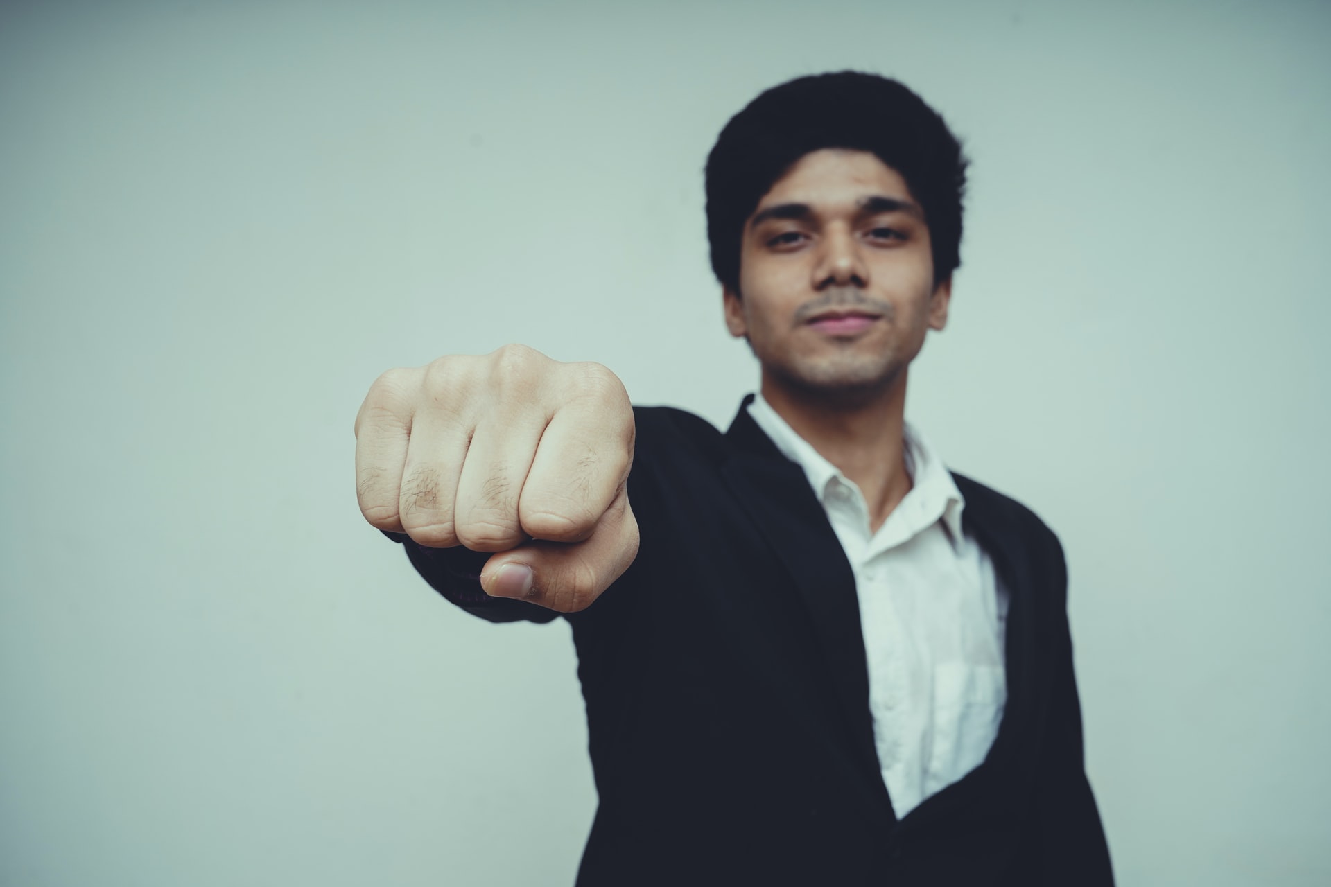 A man shows his fist to the camera.