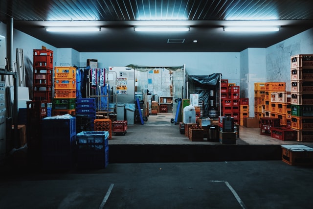 Boxes on a warehouse loading dock at night.