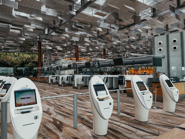 A few automatic digital check-in terminals at an airport.