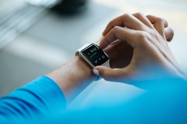 A person sets a timer on their smart watch.