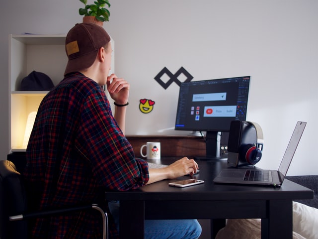 A graphic designer works on a project at home.