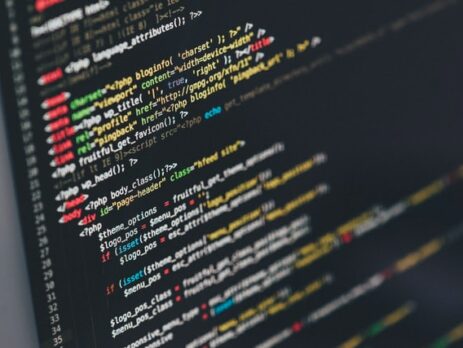 Alt-Text: Lines of code on a black computer screen. 