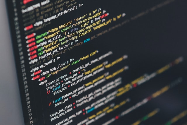 Alt-Text: Lines of code on a black computer screen. 