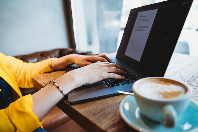 An individual looks on a website for a digital nomad.