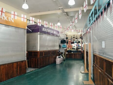 Preparing Your Business and Staff for a Recession Featured Image: https://unsplash.com/photos/a7pUfzMZz3w Caption: N/A Alt-Text: A row of shuttered stalls in an empty mall. It’s inevitable. The market will eventually enter a recession. If not this week or this month, possibly years down the road. Either way, part of owning a business is knowing how you can prepare your staff and company for a recession, should one ever be headed your way. Read on to learn more about how you can prepare your business and staff for a coming recession. What is a Recession? A recession is a period in which the economy declines rather than grows. It’s important to note that this is not the same as a depression, where the economy stays at all-time lows for a prolonged period of time. Rather a recession just sees a decline in sales, among other disheartening indicators. This downturn must last at least a couple of quarters in order to qualify as a true recession. It also must affect all parts of a sector or multiple sectors of a market. Why You Should Prepare for a Recession Unfortunately, recessions disproportionately affect small businesses, and one study performed during the great recession from 2007-2010 showed that over 5% of businesses per year ended up closing due to the economic downturn. The point is, no matter what type of business you are running, there is a huge chance you could go under during a prolonged, difficult economic period like a recession. The only way to prevent this from happening is to take steps in advance to prepare for a recession. Some preparations are easier than others, but you should take the time to do as many things as you can to prepare your business and staff for difficult times before they arrive. After all, there’s no use in preparing for a hurricane after it’s already happened. Image #2: https://unsplash.com/photos/JW6r_0CPYec Caption: There are many ways to prepare your business for a recession in advance. Alt-Text: A dollar bill on a white countertop. 8 Steps to Prepare for a Recession Whether you think negative economic times are on the horizon or not, here are some steps you can use to prepare your business for a coming recession. 1. Save Money Is your business operating on thin margins? This is a recipe for disaster during tumultuous times. Although it may not be a recession now, it’s time to take a look at your profits and save what you can for the future. Every business needs to have at least a couple of months of expenses in reserve, the more, the better. You should be building that buffer now while sales are plentiful. When you start trying to save, you may discover that your margins are too thin to allow you to do so. Now is the time to make price changes, so that isn’t the case because if you make price changes after you have already started losing a large number of sales, it will only quicken the process. 2. Diversify The companies that don’t last through a recession are those which only offer one product. Offering only one product, even in the best economic times, is risky because a replacement for that product could be made tomorrow, putting you out of business even in a bull market. Now is the time to consider diversifying your business into another area. For example, if you’ve only offered graphic design services in the past, consider offering copywriting as well, in case something were to happen to the graphic design market. If you are creating a new product, remember the sales cycle and how long it takes to bring a product to market. If the market is in a downturn already, it probably isn’t the best time to introduce something new, but this doesn’t mean you can’t still diversify. One of the best ways to diversify in a market that has already gone sour is to partner up with another business where you offer their product, and they offer yours. It may also be time to look at other sales tactics for your products. For example, in the past decade, many companies have found success selling products with subscription-based selling. 3. Lower Expenses Take a look at your budget. Are you spending close to what you make each month (besides the amount you are saving?) This isn’t a good idea when a recession is approaching, and it’s best to cut spending now. This doesn’t mean you are going to cut corners, just unnecessary spending. If you spend enough time looking at your budget, you will find something that can be cut, for example, maybe an employee has been asking to go part-time, and now would be the time to grant that request. Perhaps you’ve got an employee who has submitted their notice. Rather than investing money into a lengthy hiring process, consider hiring a contractor to do the same job. This will give you a skilled employee that you can lay off much easier if times get tough. 4. Make Changes to How Employees Work One of the biggest expenses most offices have is well, the office itself. During the COVID-19 pandemic in 2020, many businesses found that employees work just as efficiently at home as they do in the office. Therefore it might be time to take a big step and downsize your office space. While you may not be able to send all employees to work from home, send the ones that you can, and get a smaller office space just for those that have to be there in person. This can free up lots of capital for other areas of the budget, plus your employees will probably love it. 5. Be Honest With Your Employees The number one complaint employees have when they are laid off is that they didn’t see it coming or that their job lied up until the last minute that there would be layoffs. While it may seem odd, don’t lie to your employees. Now you shouldn’t go right out and say there will be layoffs, but be open with your employees about how layoffs could look (who is at risk? Who would go first?) Then let them know that you are open to ideas for helping the company save money or methods for increasing sales. You may just be surprised at how understanding your employees are because of your honesty, and they may just have an idea to boost sales you haven't thought of yet! Many companies don’t want to tell their employees there might be layoffs because they are afraid the employees will find new jobs. This is never a reason not to notify your employees of a potential layoff. If they do go out and find another job, this is good for you, as you can either have their position absorbed or hire a contractor to replace them. Either option sets you up better for a recession than if the employee had stuck around. 6. Be Reserved With Market Predictions During a booming economy, it can be easy to estimate that sales will continue to grow indefinitely and advise that your company orders more and more inventory. This thought process can go bad very quickly, however, as you may find yourself stuck in a recession with a factory of inventory you can’t sell. Instead of expecting continued exponential growth, make more reserved predictions for future sales, and adjust your inventory accordingly. It may also be worthwhile to see if you can order products more frequently, allowing you to make smaller changes based on actual sales rather than predicted growth. 7. Consolidate Debt All businesses start off with debt. While this debt is necessary for starting a business, it can also be a business’s downfall during a recession. The time to review the debts of your business is not once the recession has started but rather before it even begins. While your company is experiencing a period of growth is when you should look at your debt sheets. After you have your nest egg, consider paying down high-interest debt as quickly as possible. You can also take the time to consolidate debt or even negotiate a new interest rate for some of your most expensive debts. 8. Establish Warning Signals By now, you should be fairly prepared for a coming recession. But don’t get wrapped up in the preparations so much that you forget to also establish what signals you need to be watching for that a recession is here and it’s time to start scaling back. If you have a CFO, this job is probably best assigned to them, as they will be able to watch the cash flow and alert you when there is a fall or significant reduction. If you run a smaller business, make time to sit down each week with the financials each week, taking note when downward trends begin to form. Remember, one bad week of sales doesn’t mean you are in a recession. But if you notice a downward trend over more than four weeks, it might be time to slow your inventory ordering and schedule staff for fewer hours. Signs a Recession is Imminent It’s impossible to fully predict when a recession will arrive, but there are a few signs you should be watching for as a business that may indicate that a recession is imminent. 1. High Inflation Recessions typically follow periods of high inflation because many of the remedies for curbing inflation can lead to a recession. When there is a period of high inflation, this is a good time to start preparing your business for a recession. 2. Economic Instability In the modern age, much of the world is dependent on other parts of the world to provide goods and services. When these supply chains begin to be disrupted by war, famine, and policy changes, this is a sure sign that a recession is on its way. 3. Changes in the Investment Market You aren’t the only one watching for signs of a recession, as most Americans are also watching. Therefore watching their behavior can let you know if a recession may be on its way. If the majority of Americans are switching from high-risk to low-risk investments, this tells you that they are worried about their money as well and are more afraid to lose it. A recession might be right around the corner. 4. Lower Consumer Spending This is one of the more obvious signs, but as a recession begins to loom, consumers will lower their spending. Your CFO, or whoever handles your inventory, should be watching for this sign in particular, as this is one that will directly impact your business. 5. Decline in GDP The final sign to watch for, which is also the clearest, is a drop in GDP. Once a drop in GDP occurs, it is almost 100% likely that the country is in a recession, and it is time to start hunkering your business down to survive. Image #3: https://unsplash.com/photos/-mR1iZFz4AE Caption: It’s important to stay vigilant for signs of a coming recession. Alt-Text: People man reads a book in a coffee shop with headphones on. How Do You Know Your Business is Ready for a Recession? Have you done everything on this list but aren’t sure if your business is truly ready for a recession? The best way to know is to take a look at the financials of your business. Do you have a reserve of cash to last you for a few months? Then you are more prepared than most other businesses out there. If you also have high margins, contingency plans for excess staff, and a variable inventory you can adjust within a few weeks' time, then you are more prepared for a recession than most businesses on the market. Ready to Prepare Your Business for a Recession? No matter how you look at it, preparing your business for a recession is a necessary part of owning a business. Whether you are in the service or products sector, a recession hurts businesses everywhere, and many could go under. Help protect your business from going under by preparing in advance and if your business is struggling, in general, to make ends meet, even in a booming market, take a look at how to win an audience as an underdog brand to help you to find your place in the market. WordPress Information: Permalink: https://www.icreatives.com/preparing-for-a-recession/ Meta Description: Learn about how you can prepare your staff and your business for a recession so you can survive even the toughest economic times!