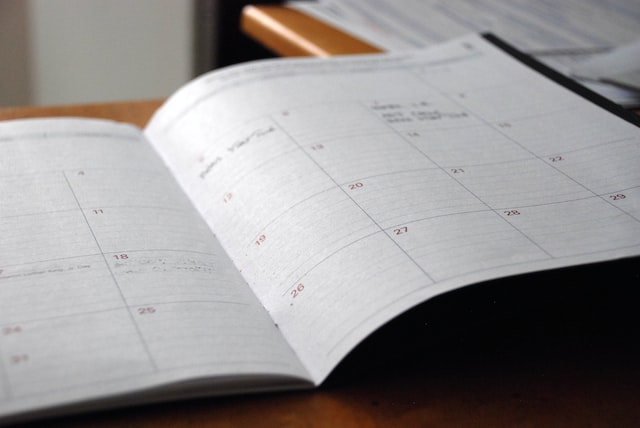 A day calendar flipped open and blurred out.