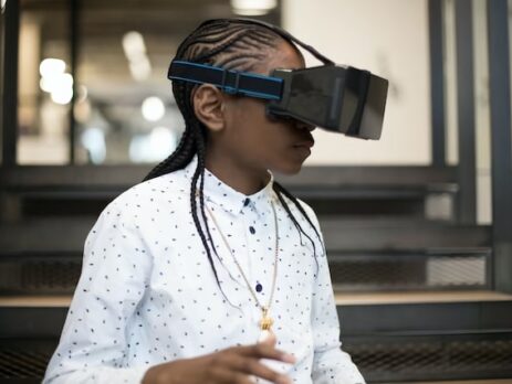 An individual wears a VR headset, spending time in the metaverse.