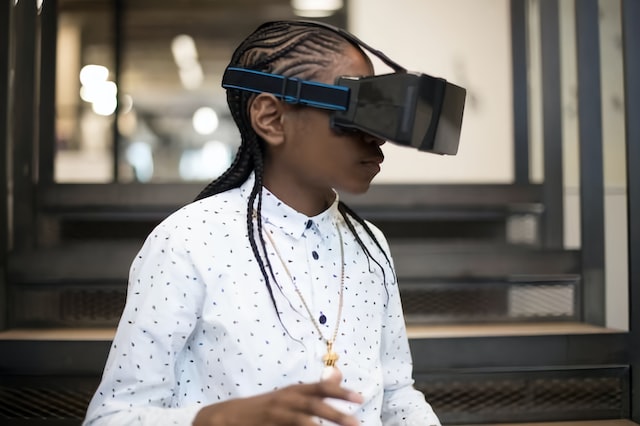 An individual wears a VR headset, spending time in the metaverse.
