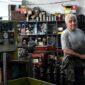 A man stands in a family-owned mechanic shop.