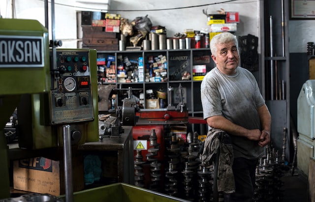 A man stands in a family-owned mechanic shop.