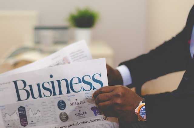 A man reads the business section of the newspaper.
