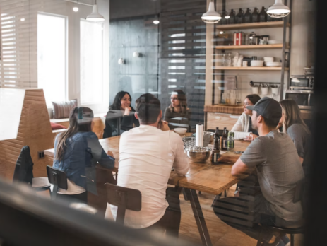 A group of people holding a meeting.