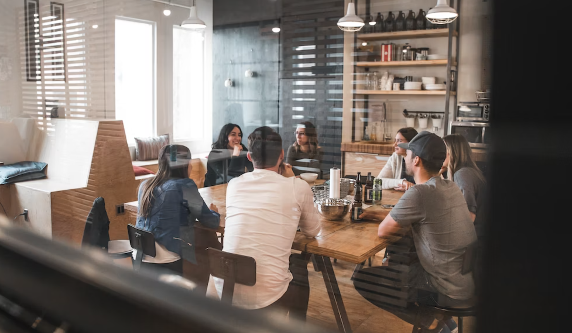 A group of people holding a meeting.