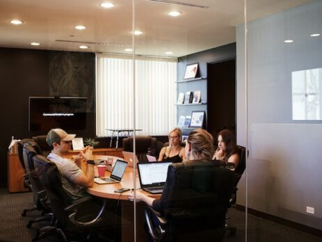 a team seating around a table