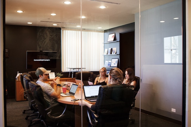 a team seating around a table