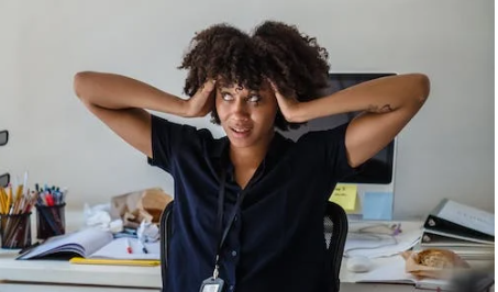 Woman sitting nonchalantly in office