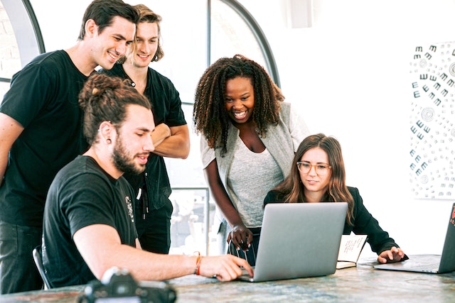 Male and female employees sitting together