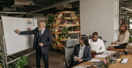 Four people having a meeting