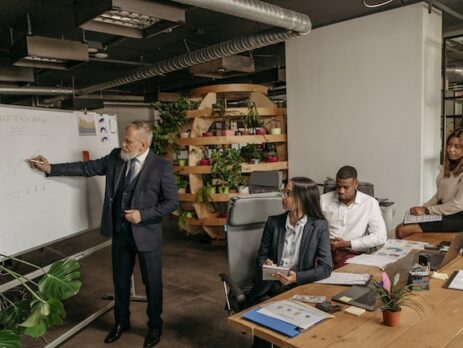 Four people having a meeting