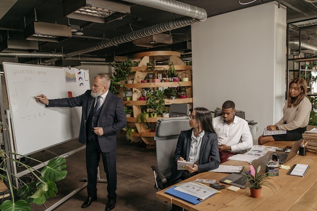 Four people having a meeting