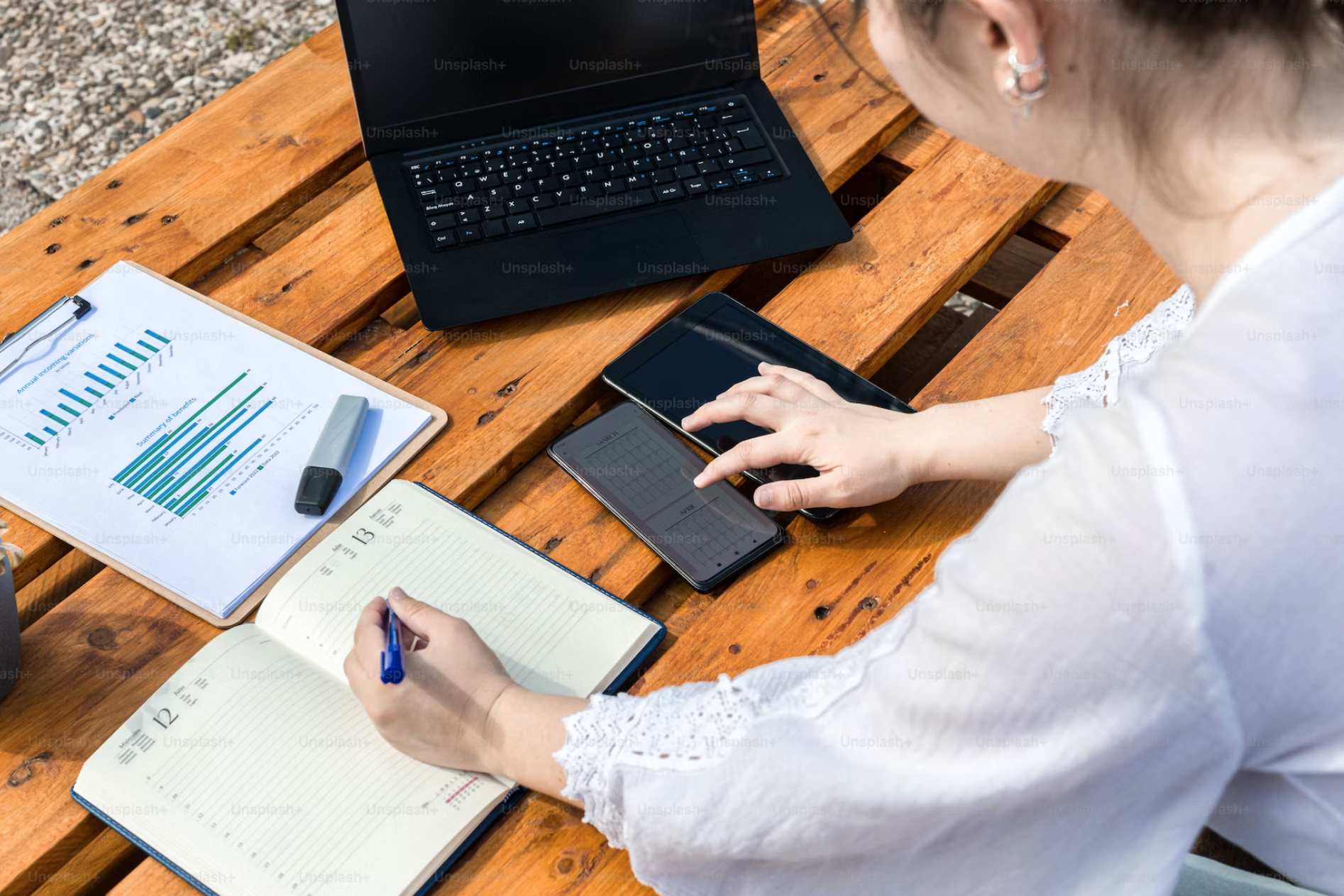 A woman at a desk with her workload.