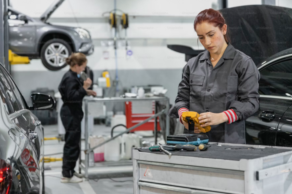 A woman working in the car manufacturing industry.