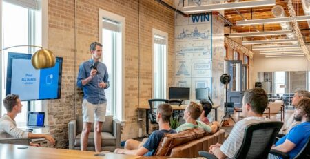 A man giving a presentation to his co-workers.