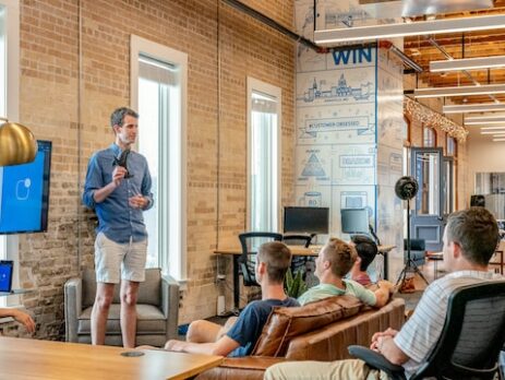 A man giving a presentation to his co-workers.