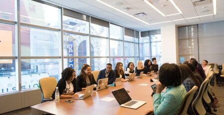 A group of people in a board room.