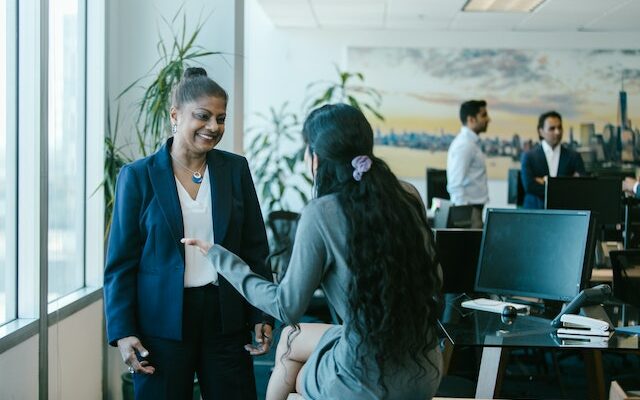 women talking in the office