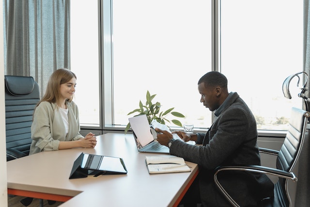 Man interviewing a woman