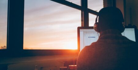 A man working remotely on his computer.