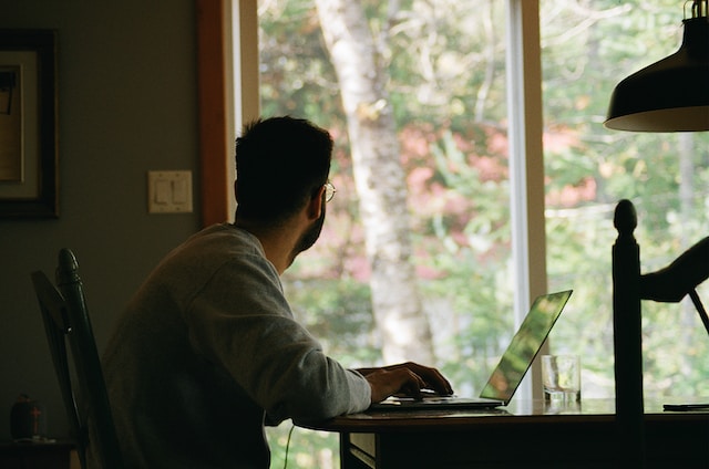 A man working remotely from home.
