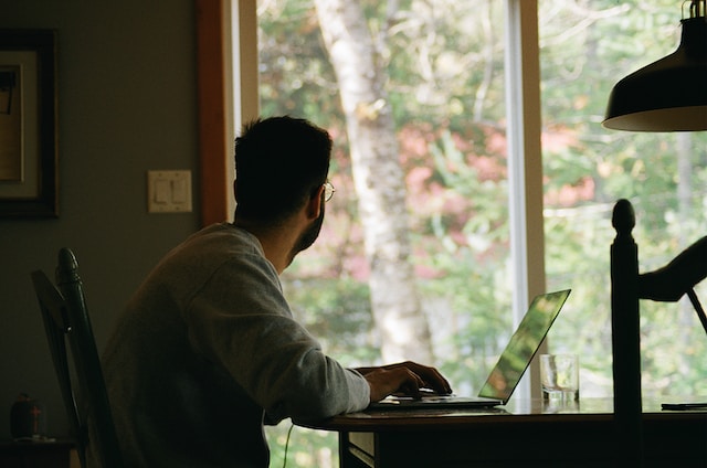 A man working remotely from home.