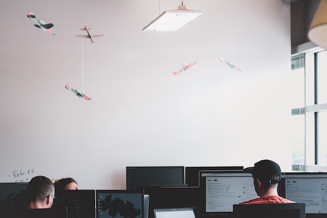 A group of co-workers at the office working on their computers.