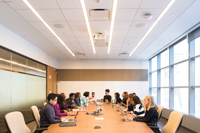 People sitting around a table in a conference room.