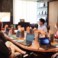 man giving a presentation in a boardroom 
