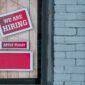 Signs that say “We are hiring” and “Apply today”