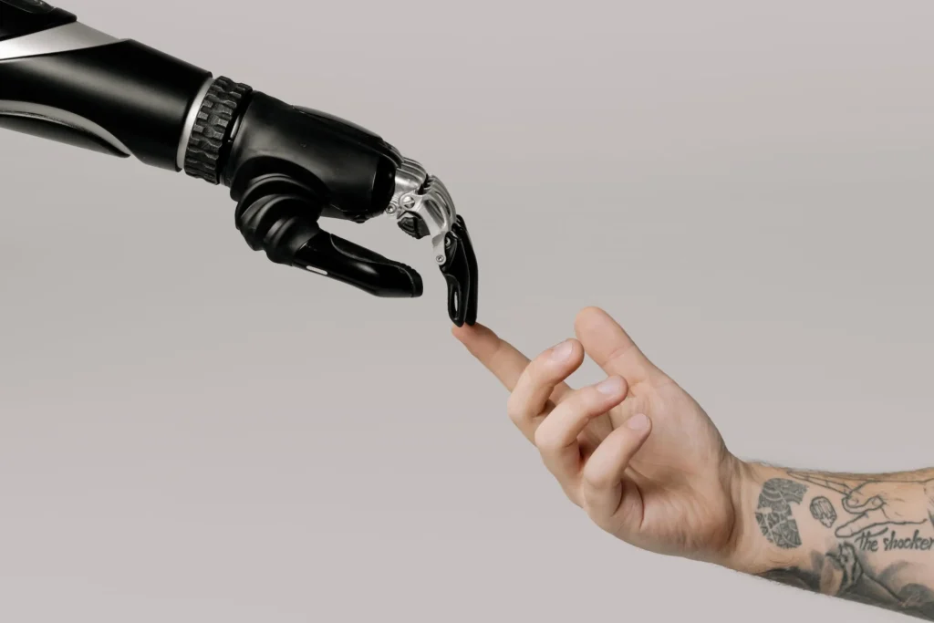 A bionic hand and human hand.
