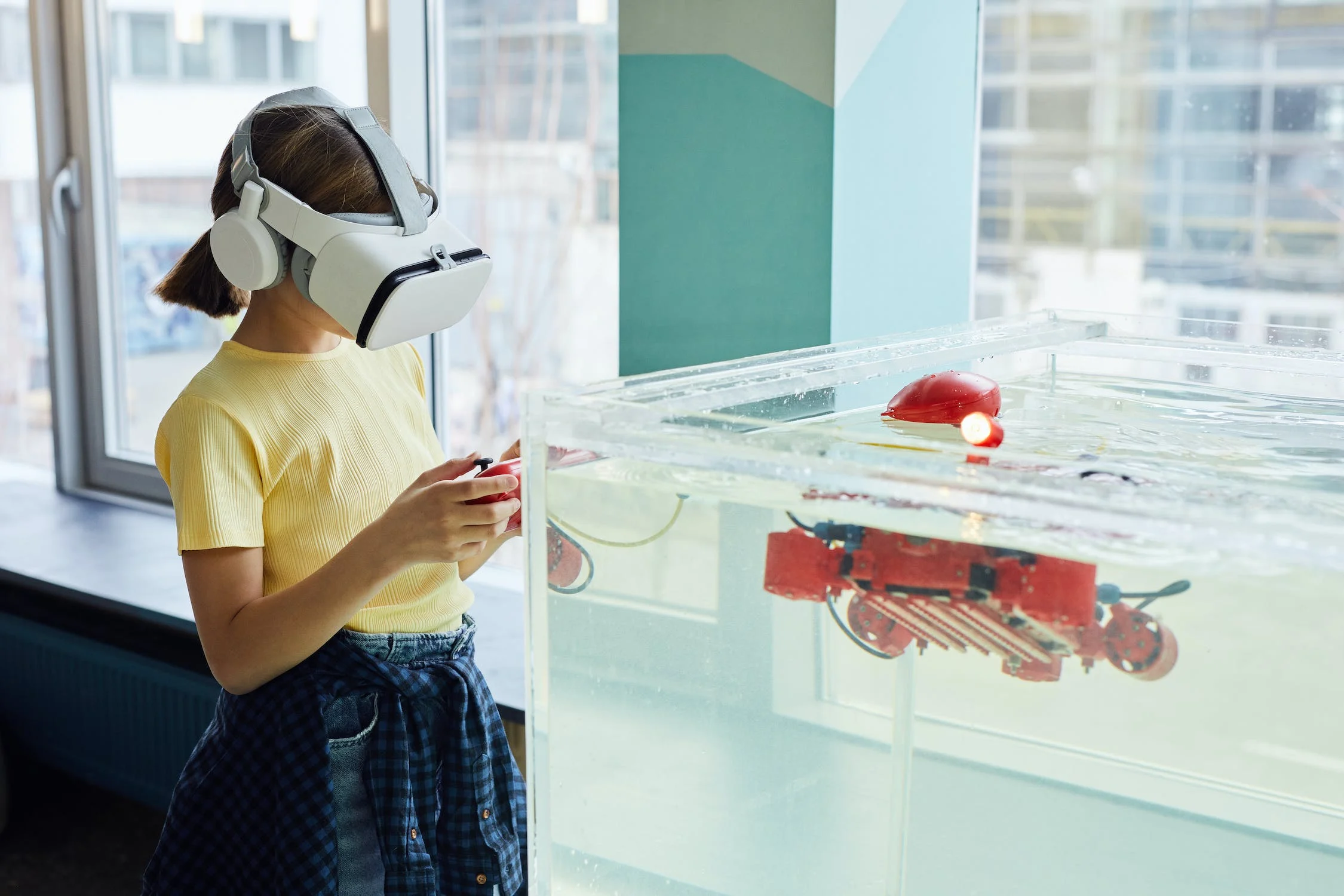 A girl using VR headset testing new device.