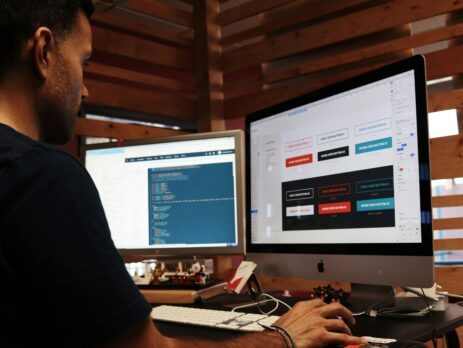 Man working on a design with an iMac