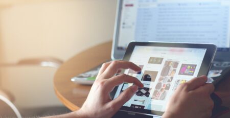 Person holding a black iPad