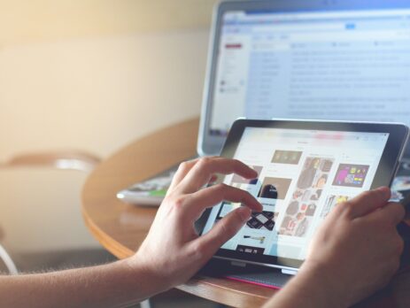 Person holding a black iPad