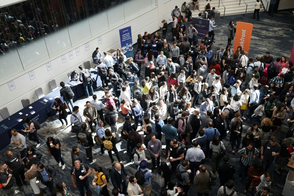 crowd of people in the lobby of a building