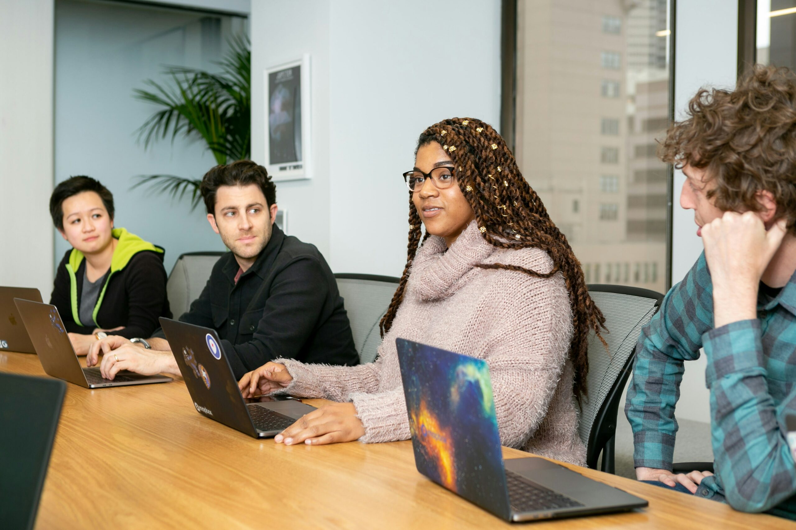 People discussing with computer